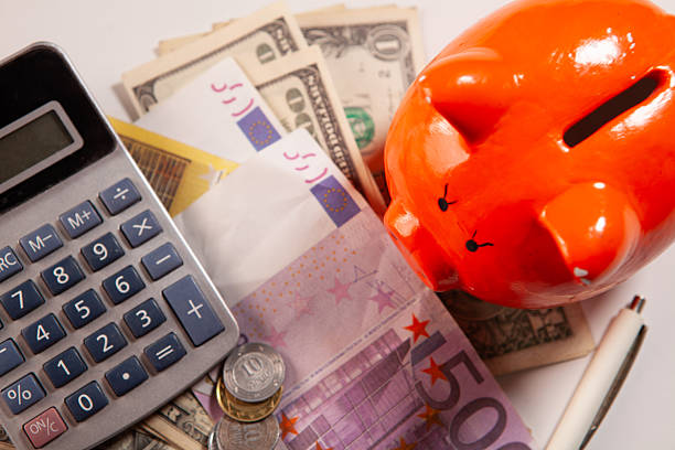 istock piggy and calculator on table, saving and finance concept. 2222944987