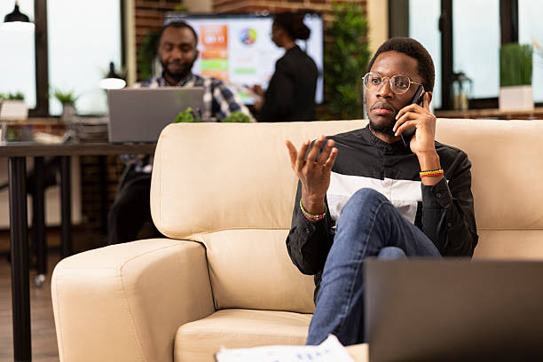 istock Male entrepreneur using cellphone in office 2222946677