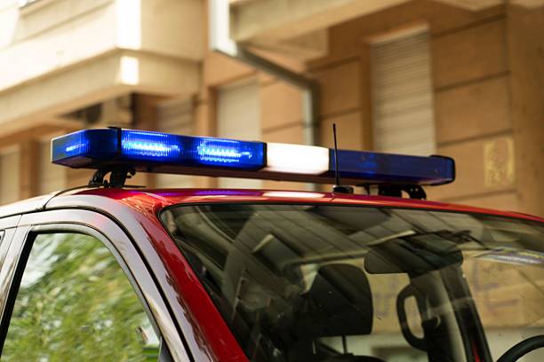 istock Blue strobe lights on red emergency vehicle in daylight 2222947034