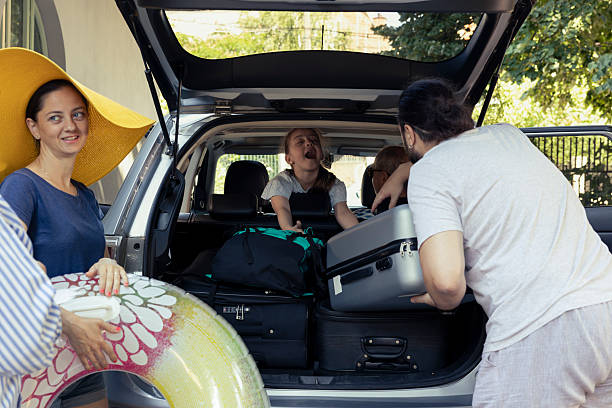 istock Multi generational family shares a cheerful car packing activity before journey 2222947311