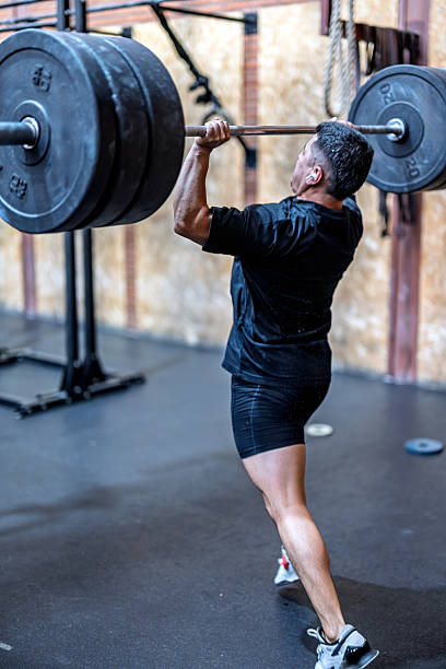 istock Weightlifting athlete performing a clean and jerk in training session 2222947844