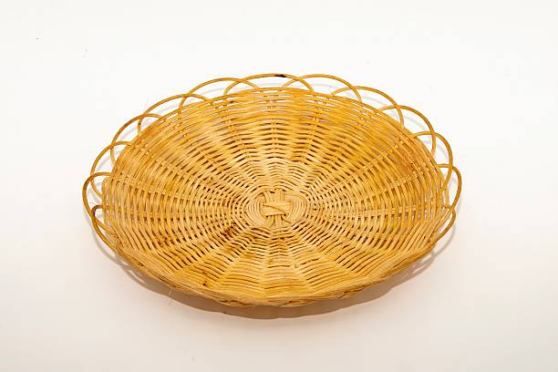 istock Handmade woven rattan placemat on white background 2222950433