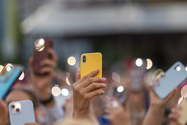 istock Concert Crowd, Recording on Smartphones 2222951110