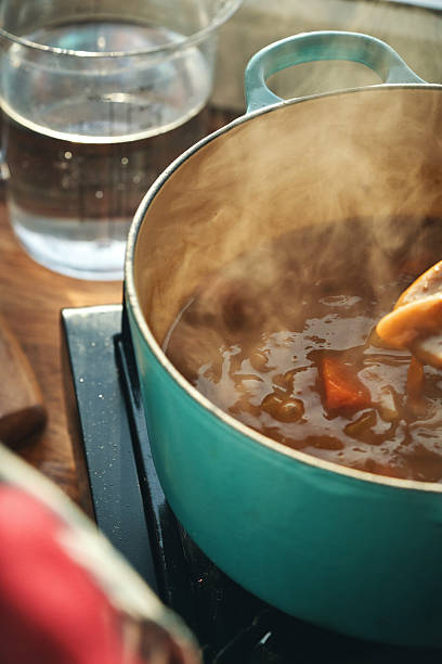 istock Preparing Japanese Katsu Curry with Crispy Chicken and Vegetables 2222951873