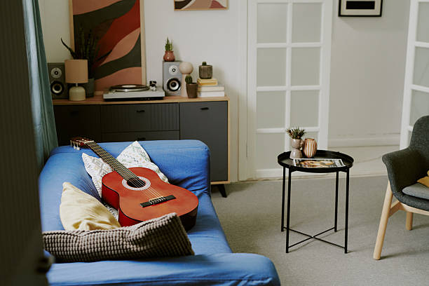 istock Acoustic Guitar on Living Room Sofa 2222953388