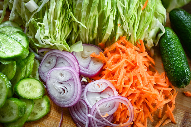 Fresh Vegetables on the Table in the Kitchen, Highlighting the Concept of Home-Grown Produce. The Scene Showcases a Variety of Vegetables Harvested from a Home Garden, Emphasizing the Natural and Healthy Qualities of Home-Grown Food. The Bright and Inviting Kitchen Setting Enhances the Focus on Nutritious, Locally-Sourced Ingredients.
