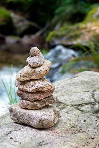 istock Balanced stacked stones rock cairn pyramid 2222953850