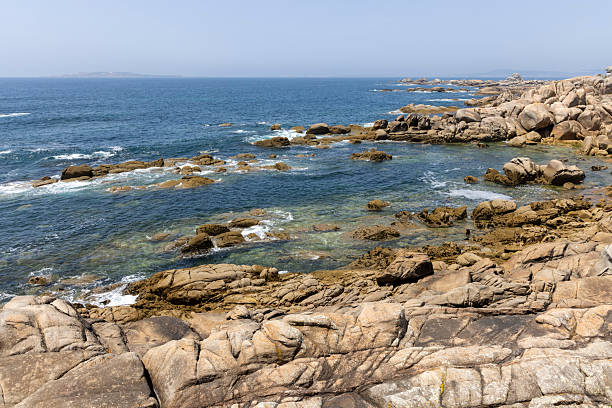 istock A rocky shoreline with a calm ocean in the background 2222958083