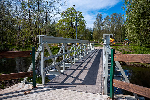 istock Pedestrian Bridge with Metal Railings in a Park Setting 2222959406