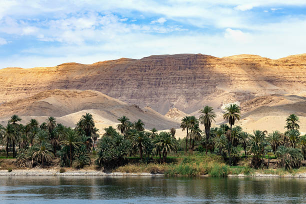 Esna, Egypt, April 14, 2023: View of the mountains and the coast of the Nile River on sunny spring day.