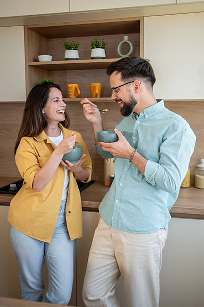 istock Happy couple enjoying breakfast together in modern kitchen 2222963449