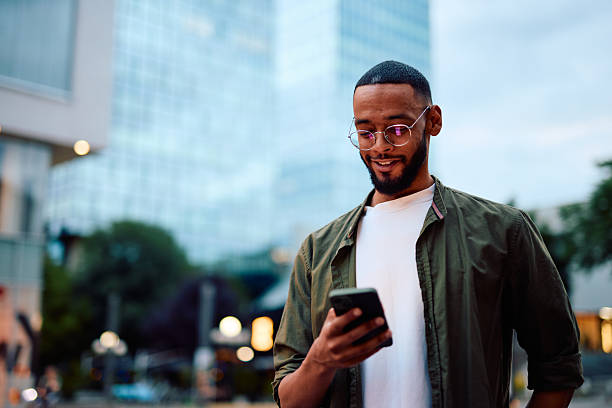 istock Young businessman using smartphone in urban city context 2222963842