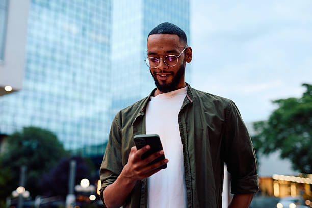 istock Young businessman using smartphone in urban city context 2222963846