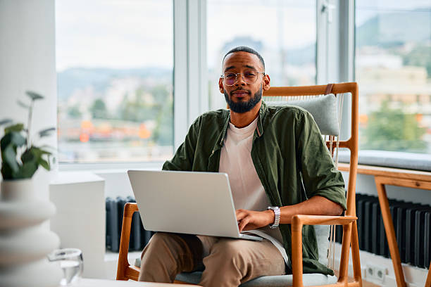 istock Young businessman working on laptop in modern office 2222964120