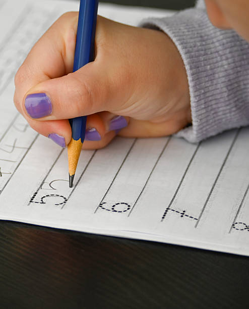 istock Writing practice for a child who is just learning numbers 2222964156