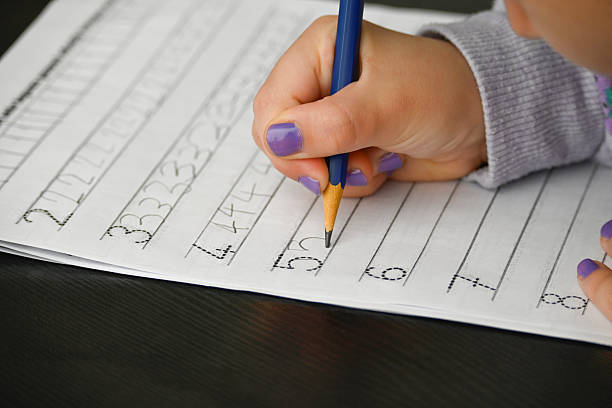 istock Writing practice for a child who is just learning numbers 2222964354