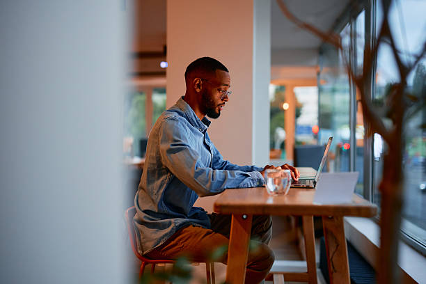 istock Focused young businessman working on laptop in modern office 2222965097