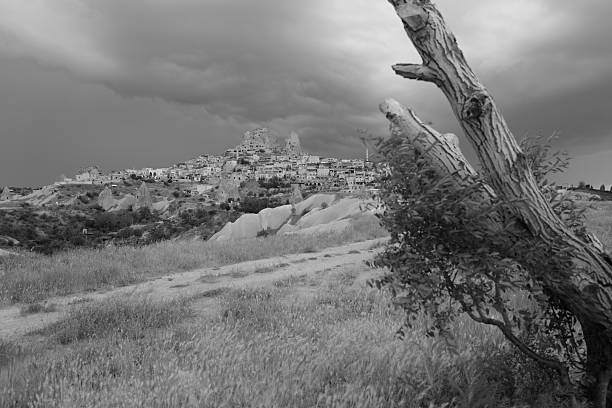 Cave houses on a hill under stormy sky, Cappadocia, Turkey