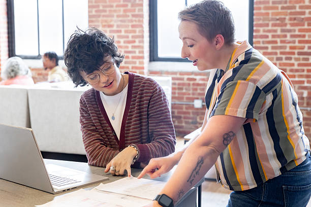 istock Women discuss ideas during consultation meeting in modern office space 2222980951