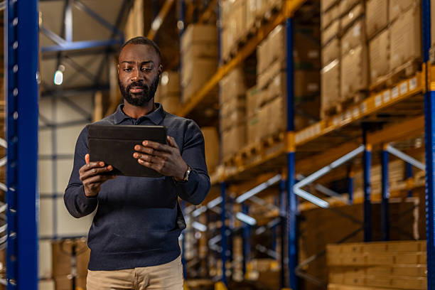 istock Warehouse Manager Reviewing Inventory Data on a Digital Tablet 2222983020