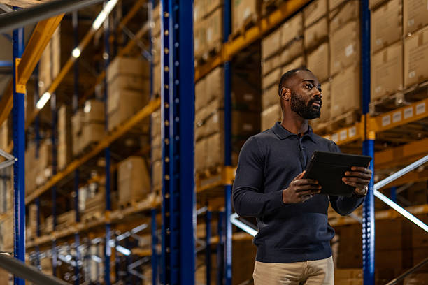 istock Warehouse Supervisor Using a Tablet for Inventory Management Amidst Storage Shelves 2222983022