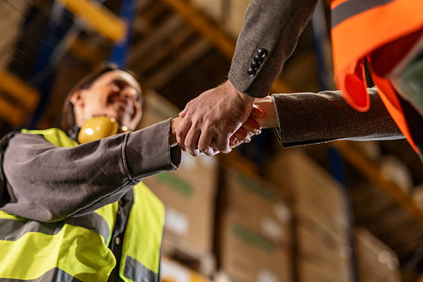 istock Warehouse Professionals Shaking Hands for a Successful Business Agreement 2222983029
