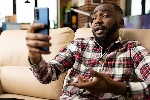 istock Confident manager attending online meeting on phone 2222983426