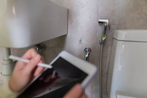 istock closeup hand with digital tablet record down defects on new building stock photo 2222985483