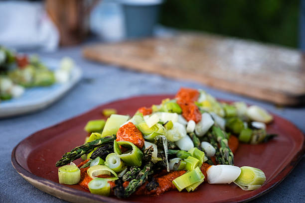 Vegan warm salad of roasted asparagus and sweet peppers