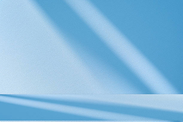 istock Studio style background wall decoration presentation uses white and blue tones. with shadows cast from a nearby window, concept creating a decorative 2222988151