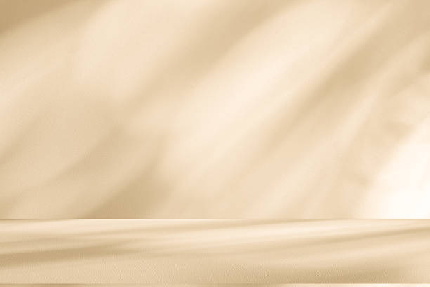 istock Studio style background wall decoration presentation uses white and beige tones. with shadows cast from a nearby window, concept creating a decorative 2222988188
