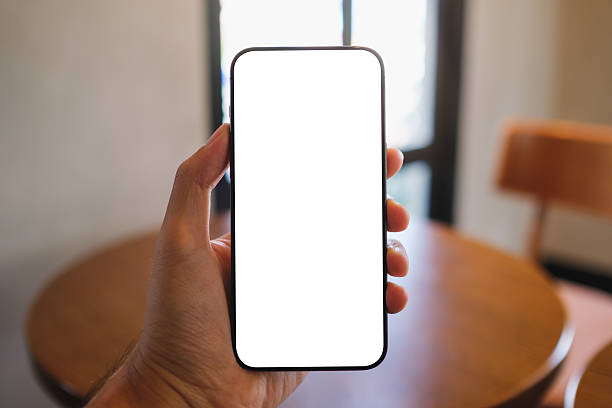 istock Mockup image of a man holding mobile phone with blank white screen in cafe 2222991927