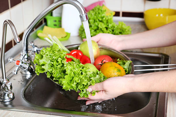 istock Vegetables washing in the kitchen 2222998040