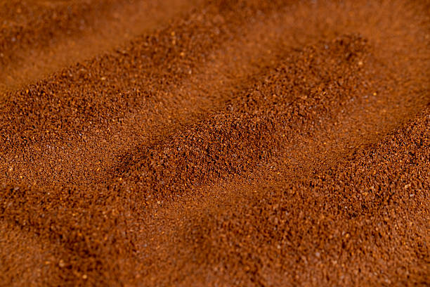 istock brown ground coffee roasted before grinding, an abstract uneven ground coffee bean background for making a high-quality and aromatic coffee drink 2223003123