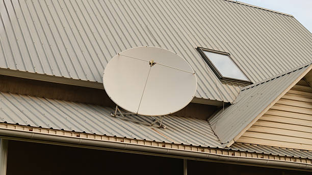 istock Satellite dish on residential house rooftop 2223004931