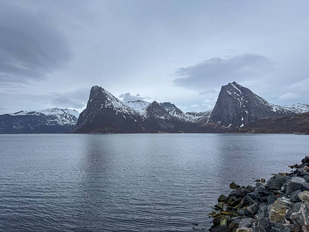 istock Snowy Mountains Over Calm Arctic Ocean Water 2223008543