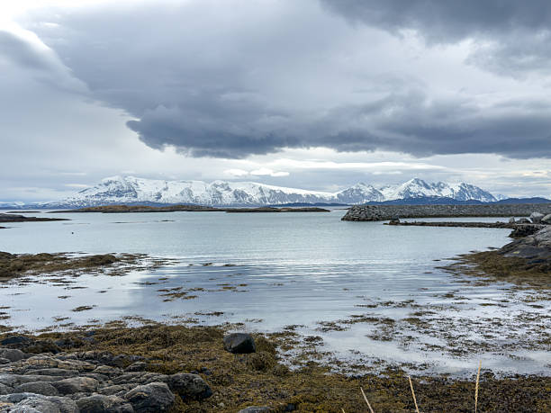 istock Snowy Mountains Over Calm Coastal Waters 2223008573