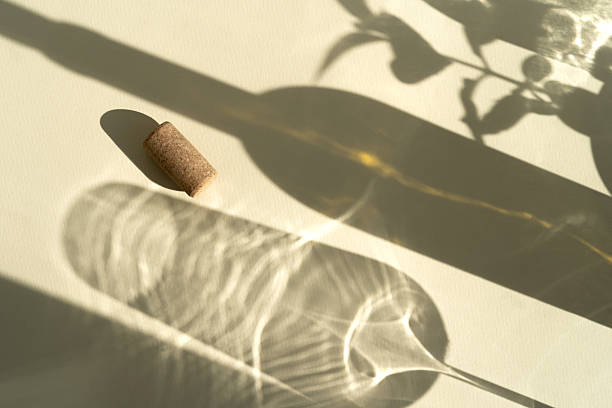 istock Different glasses for wine, cocktails, drinks, long sun shadow on a light beige background. The concept of wine tasting or summer vacation 2223008756