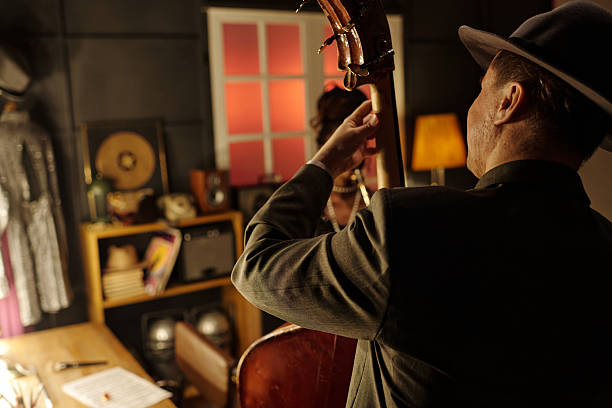 istock Middle Aged Caucasian Man Playing Double Bass in Jazz Band Performance 2223013286