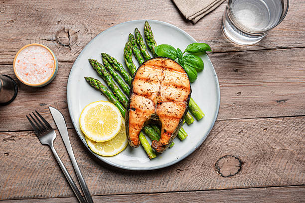 istock Grilled salmon fish steak over grilled asparagus 2223013990