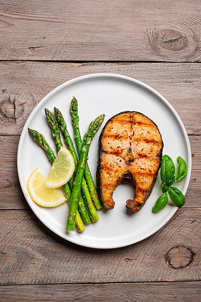 istock Grilled salmon steak with roasted green asparagus 2223014153