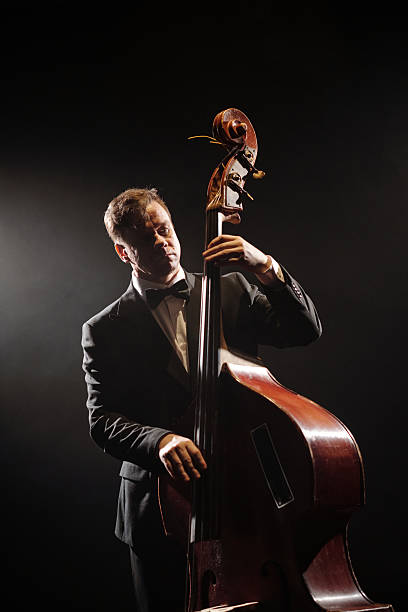 istock Caucasian Middle Aged Man Playing Double Bass on Stage during Jazz Performance 2223015632