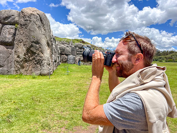 istock Man Taking Photos at Ancient Stone Ruins 2223016831
