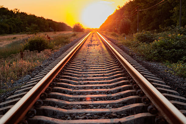 istock Train tracks. railroad tracks at sunset 2223017989