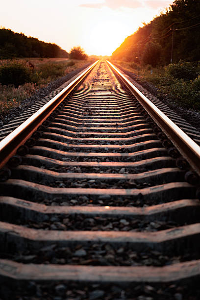 istock Train tracks. railroad tracks at sunset 2223018015