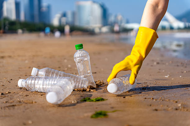istock Coastal Cleanup Effort Plastic Bottles on Beach 2223019270