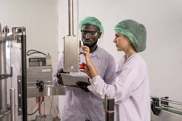 istock quality supervisor food or beverages technician inspection about quality control food or beverages before send product to the customer. Production leader recheck ingredient and productivity. 2223020520