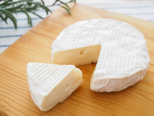 istock Camembert cheese on the wooden board 2223021071