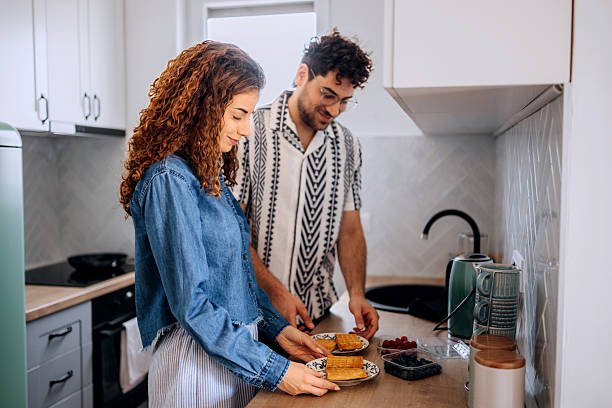 istock Couple preparing blueberry waffle together in kitchen 2223021240