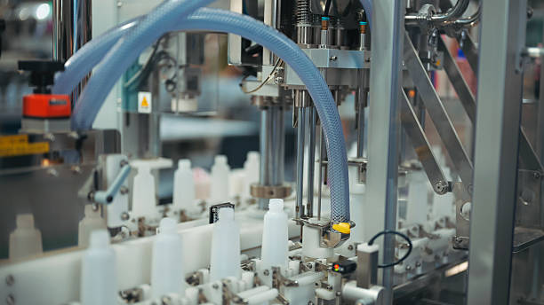 istock smart robotic system filling small bottles on conveyor in automated phamaceutical technology packaging manufacturing line | precision filling and capping system for cosmetic or medical production 2223022459